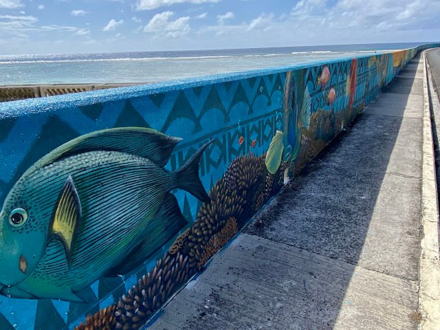 A view of the Marae Morana Mural painted of the Nikao seawall in Rarotonga.