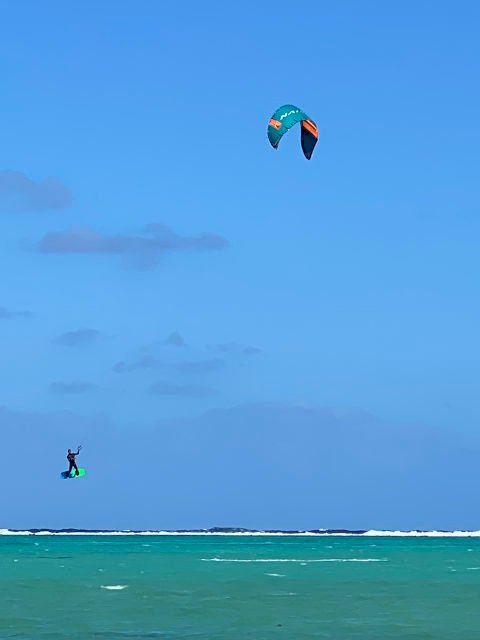 Kite surfer in the air in Muri Lagoon, Rarotonga