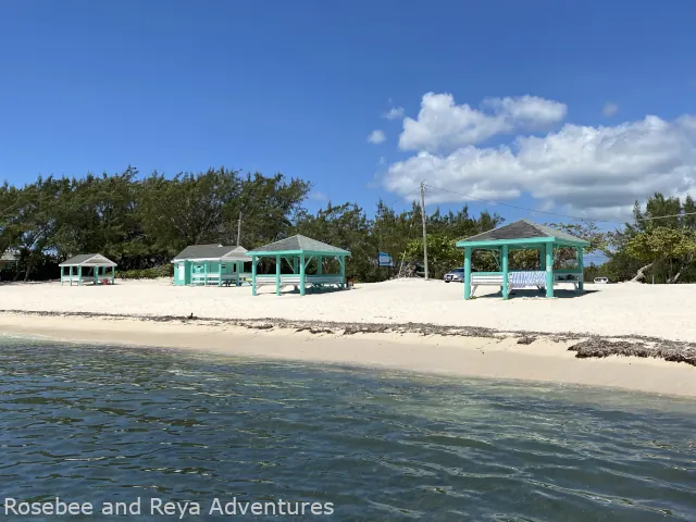 View of the cabanas and the shoreline on Colliers Beach in Grand Cayman Island.