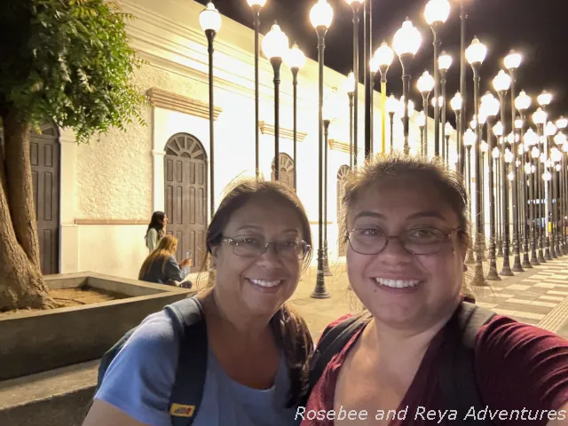 Picture of Rosebee and Reya at the Luminarias display at night at La Paz's Museum of Art, one of the things to do in La Paz.