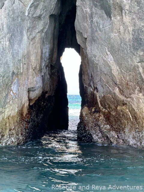 View of the Pacific Ocean through the Window to the Pacific rock formation in Cabo San Lucas