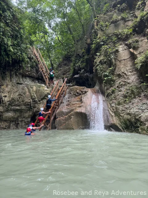 View of ladder and natural waterfall slide.