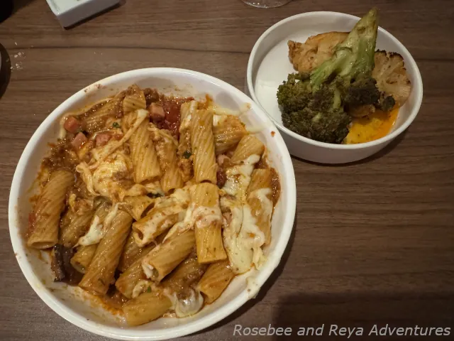 Picture of the Il Capitano's Signature dish and a side of roasted broccoli and cauliflower that was on the Carnival Celebration