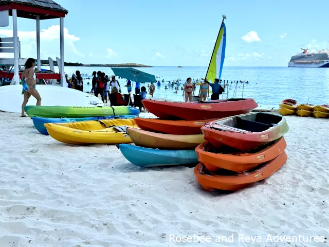 Kayaks, paddle board, and a Hobie catamaran available for rent on the beach at Half Moon Cay