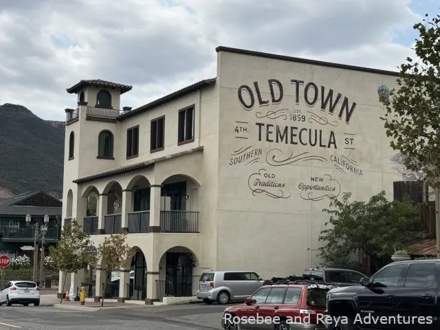 View of a building in Old Town Temecula with the words "Old Town Temecula" painted on its wall.