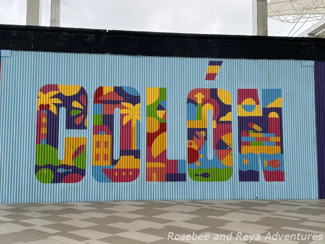 Picture of a colorful painting of the word Colon on a wall at the Duty-Free Mall by the Colon cruise port