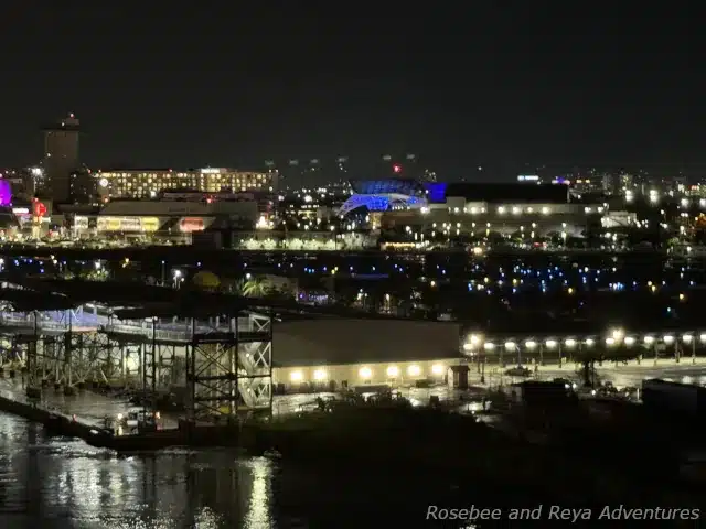 Picture of the Pan American Pier cruise terminal at night with a view of the T-Mobile District in the distance