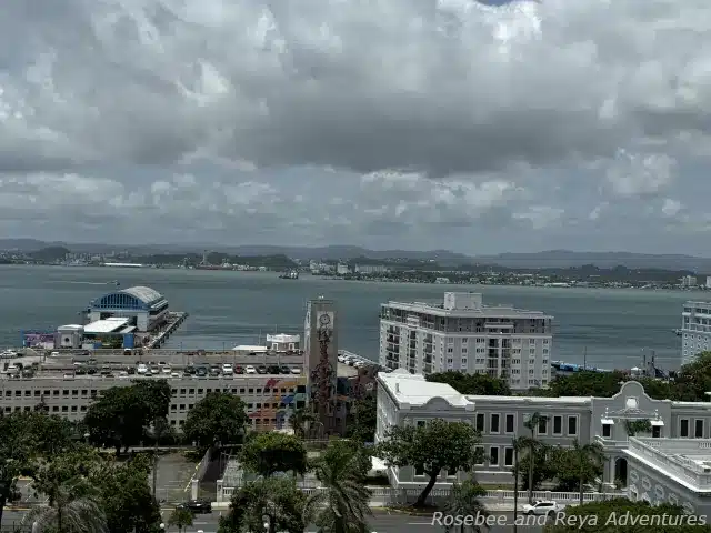 Picture from Old San Juan looking out to the San Juan Cruise Port with a view of Pier 4 cruise terminal where Virgin Voyages departs on cruises from.