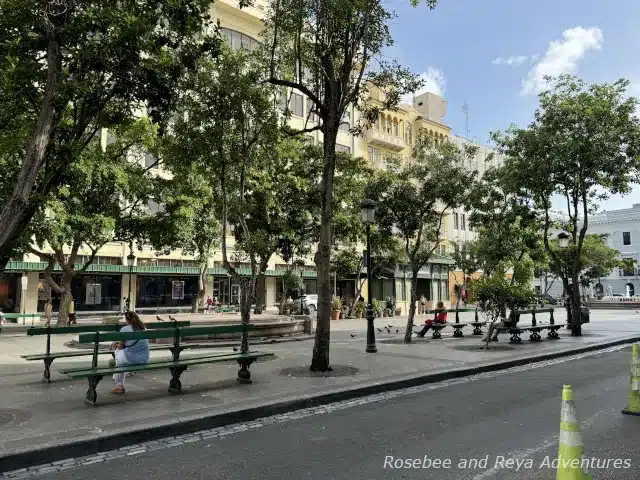 Picture of people sitting on benches in Plaza de Armas in Old San Juan, Puerto Rico