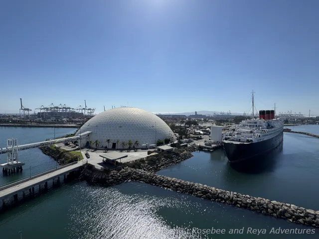 Picture of the view from the cruise ship of the Long Beach Cruise Terminal and the Queen Mary next door to the cruise terminal