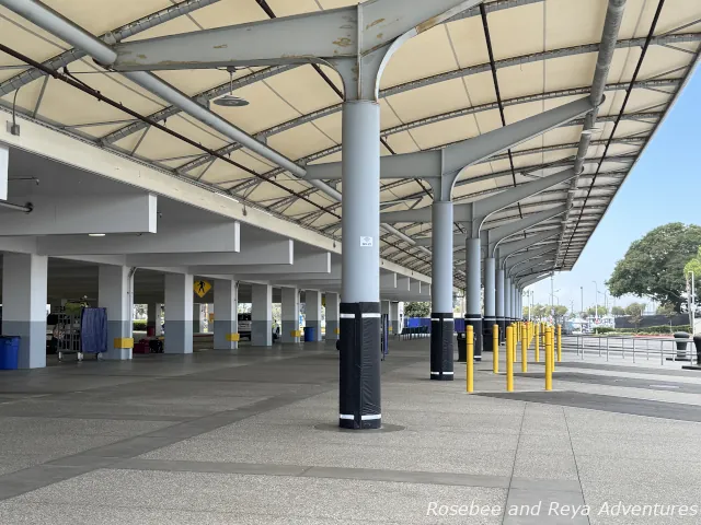 Picture of the ground level of the parking garage looking at the drop-off & pick-up area where the porters are.