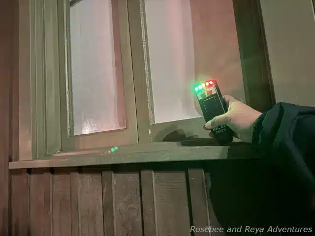 Picture of an EMF reader lighting up red for the paranormal